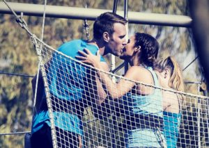 Kissing on the flying trapeze board Sydney