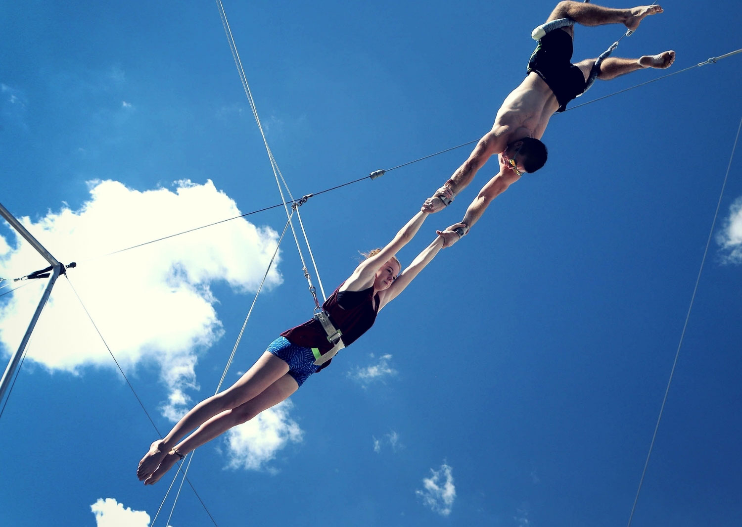 Outdoor flying trapeze catch in safety lines Circus Arts Sydney